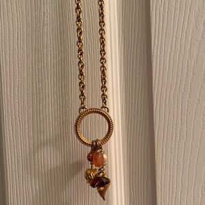 Gold necklace with charms
